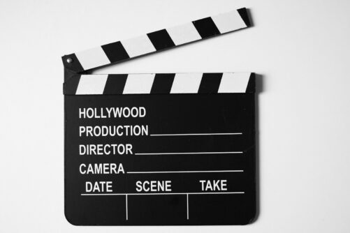 a black and white film clapper on a white background