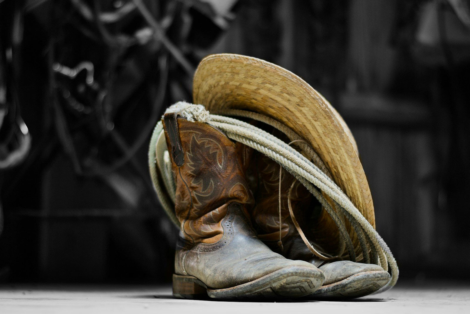 Photo by JosephHershMedia brown cowboy boots on white textile