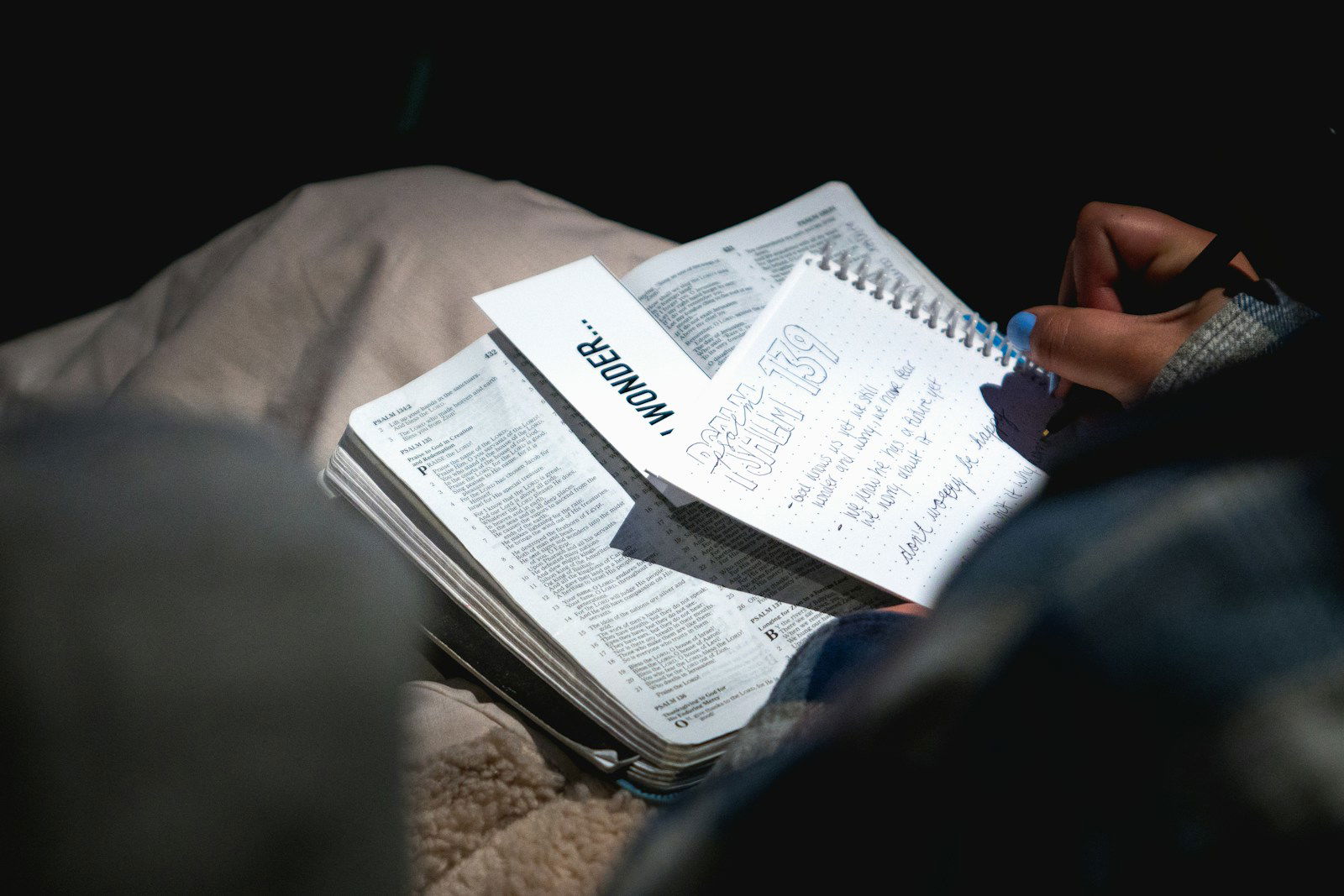 Photo by Matt Botsford person holding black pen and writing on white notebook