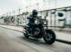 person riding motorcycle on concrete road