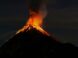 a volcano erupts lava as it erupts into the night sky