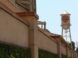 a tall water tower sitting next to a building