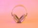 pink and white wireless headphones