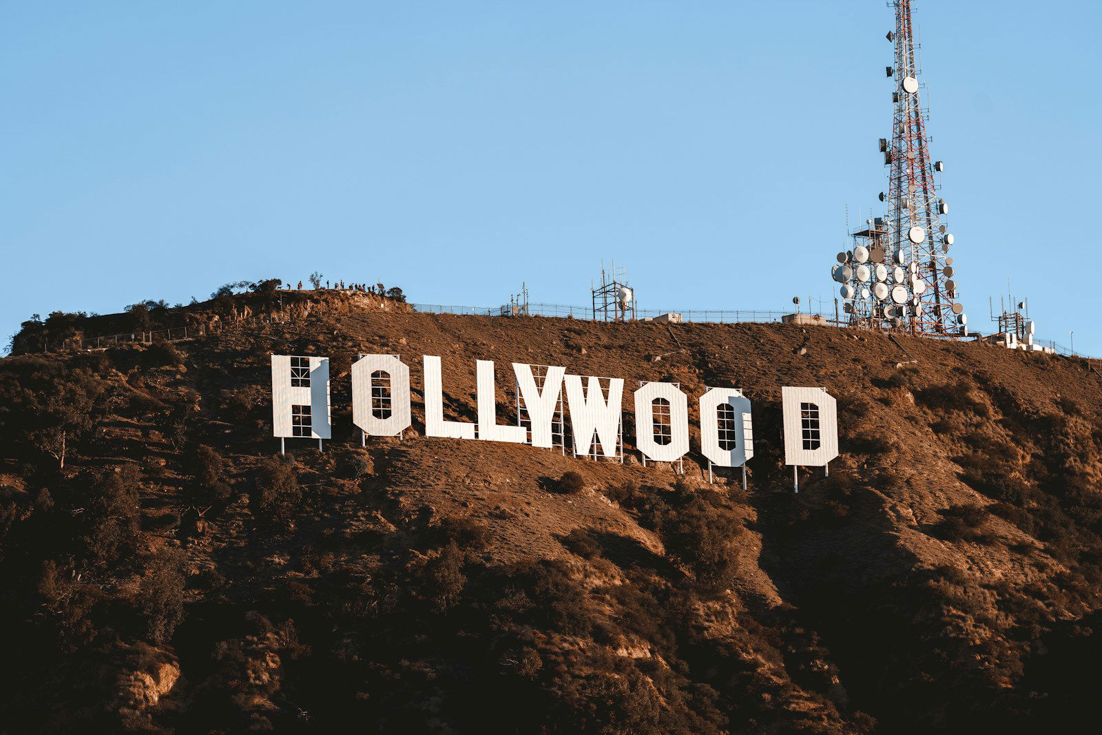 Photo by Mauro Lima the hollywood sign is covered in dirt on top of a hill