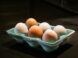 six white and brown eggs
