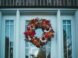 a wreath on the front door of a house