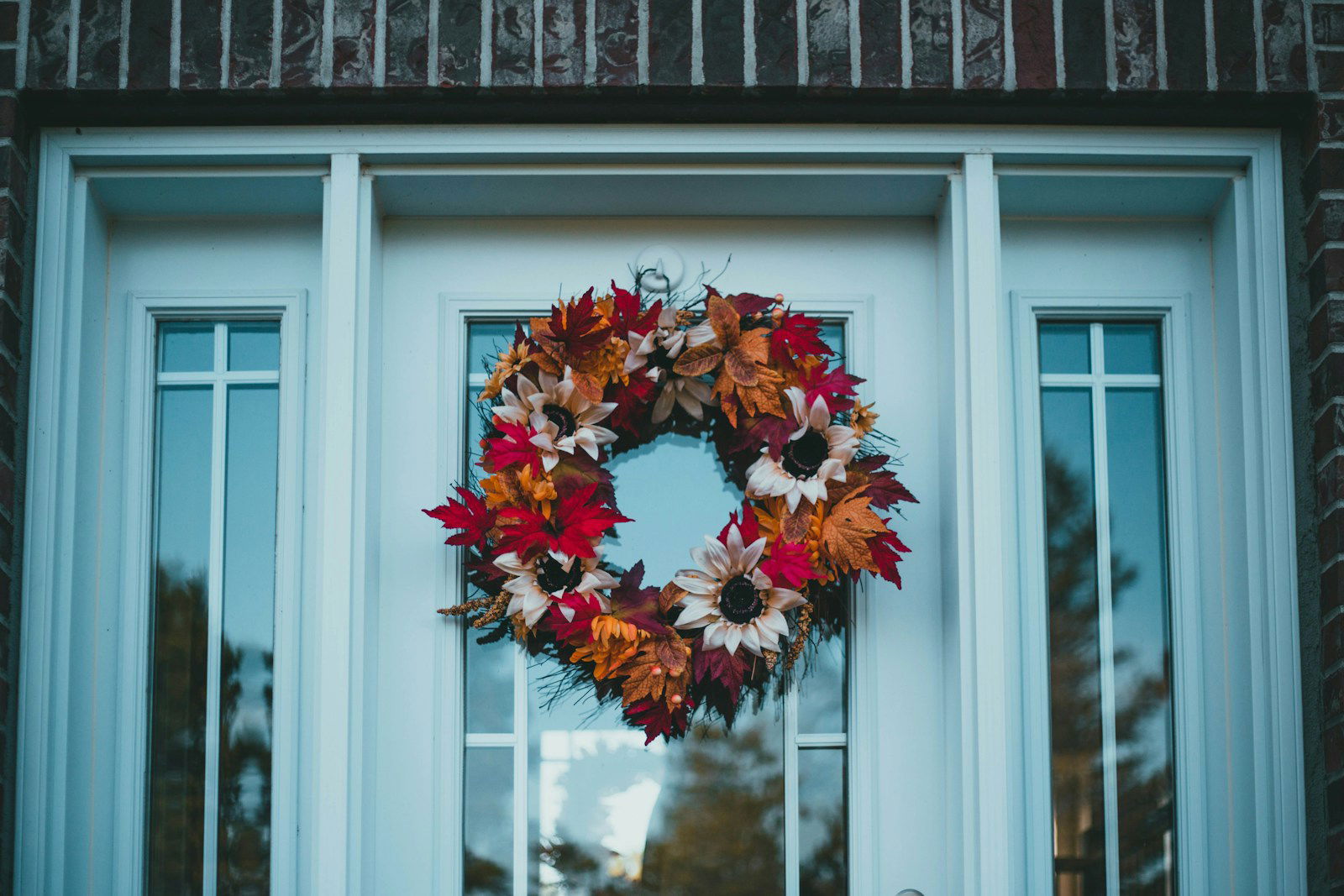 a wreath on the front door of a house