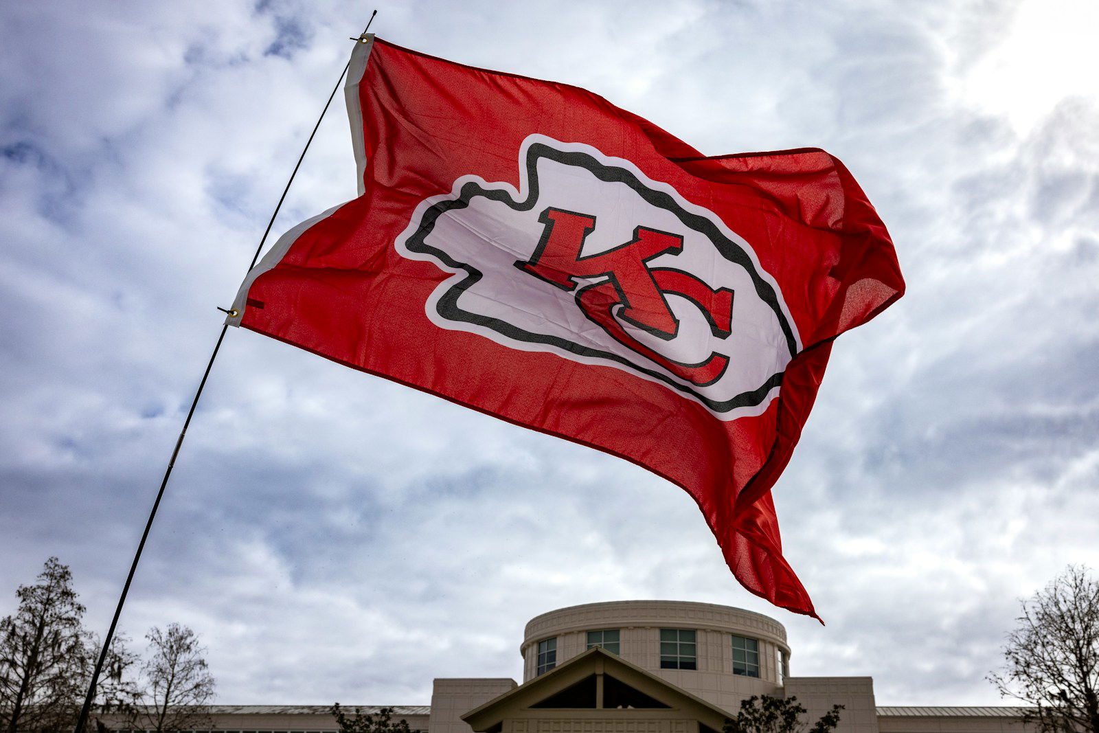 Photo by Mick Haupt a kansas chiefs flag flying in front of a building