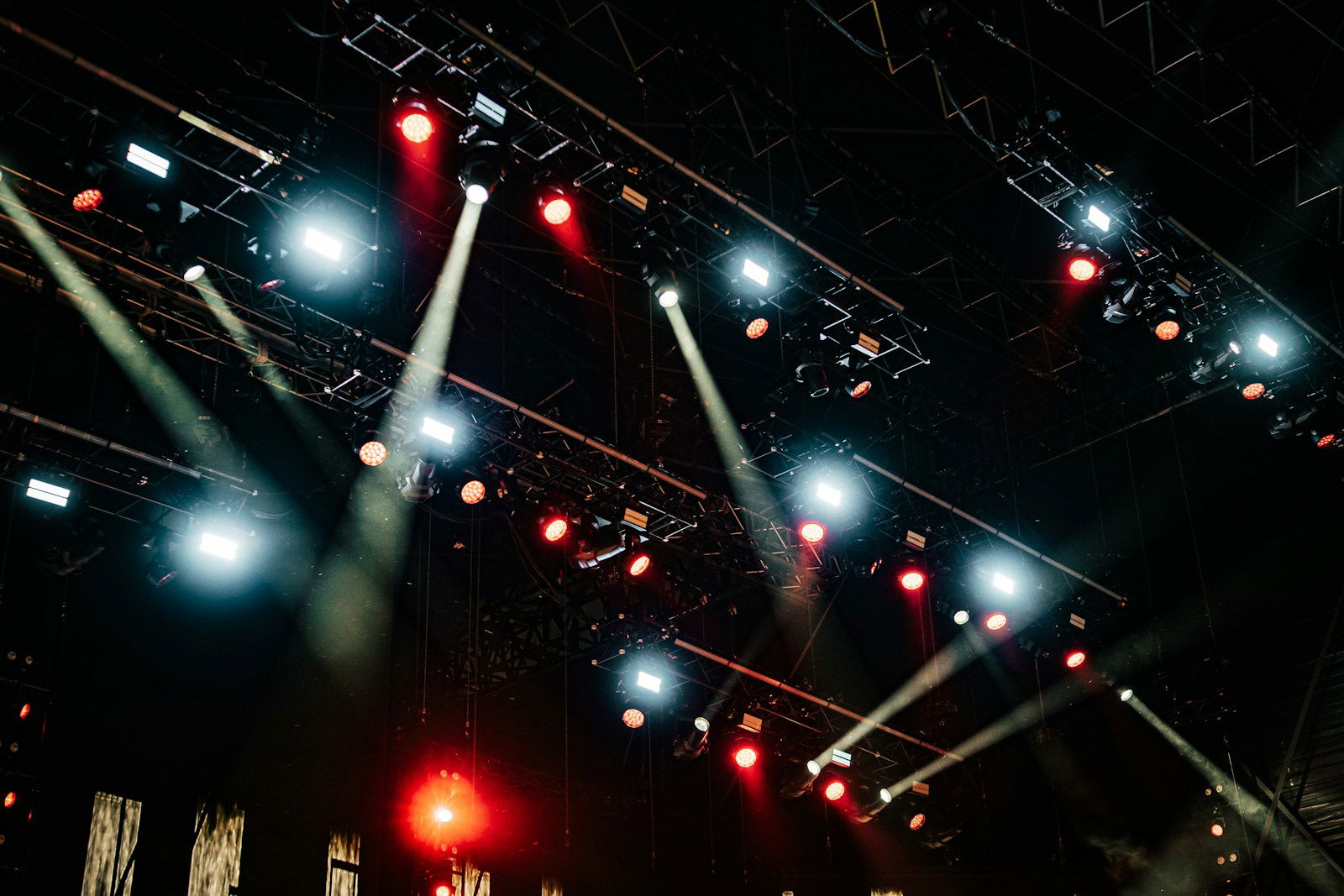 Photo by Ambitious Studio* | Rick Barrett A group of people standing on top of a stage